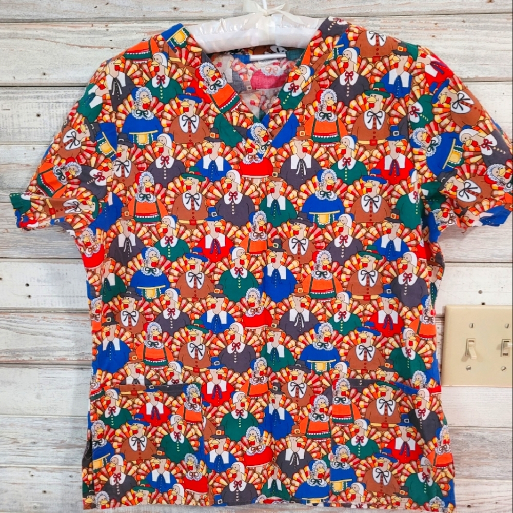 Thanksgiving Scrub top. Tag is missing but fits like a small.